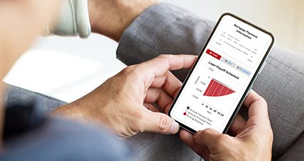 Financial Calculator_Mobile Person looking at a financial calculator on their phone